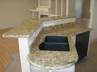 Venetian Gold Granite With Black Granite Composite Sink and Custom Rounded End-Cap
